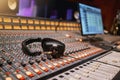 Sound board, music and production with headphones in recording studio with creativity and audio equipment. Mixing Royalty Free Stock Photo