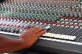 Sound controler`s hand adjusting audio mixer Royalty Free Stock Photo