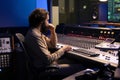 Sound designer mixing and mastering music in recording studio Royalty Free Stock Photo