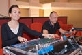 Sound engineer and producer working together at mixing panel Royalty Free Stock Photo
