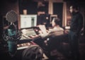 Sound engineer and producer working together at mixing panel in the boutique recording studio. Royalty Free Stock Photo