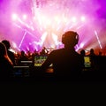 Sound engineer working at mixing panel on a big concert. Royalty Free Stock Photo