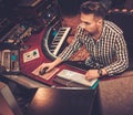 Sound engineer working at mixing panel Royalty Free Stock Photo