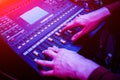 Sound engineer working at mixing panel in the in sound recording studio. Royalty Free Stock Photo