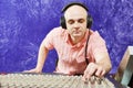 Sound engineer works with professional musical mixer Royalty Free Stock Photo