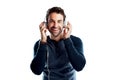 The sound on these headphones are awesome. Studio portrait of a handsome young man using headphones against a white