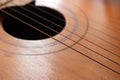 Sound hole of the guitar with the strings for the background Royalty Free Stock Photo