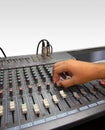 Sound mixer console and hand on white Royalty Free Stock Photo