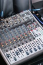 Sound mixer. Professional audio mixing console with lights, buttons, faders and sliders. Royalty Free Stock Photo