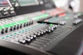 Sound mixer. Professional audio mixing console with lights, buttons, faders and sliders. Royalty Free Stock Photo