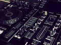 Sound mixing console detail, close up. DJ professional music console. Wide angle photo of black sound mixer controller with knobs Royalty Free Stock Photo