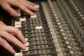 Sound producer moving faders of dirty sound mixer Royalty Free Stock Photo