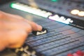 Sound recording studio mixer desk: sound engineer is operating a professional music production Royalty Free Stock Photo