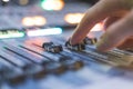 Sound recording studio mixer desk: sound engineer is operating a professional music production Royalty Free Stock Photo