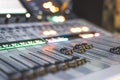 Sound recording studio mixer desk: sound engineer is operating a professional music production Royalty Free Stock Photo