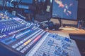 Sound recording studio mixer desk: professional music production, equipment in the blurry background Royalty Free Stock Photo