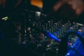 Sound technician control the music. Professional audio, mixer controller panel. Pro equipment for concerts. Selective focus. Dark Royalty Free Stock Photo