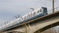 Sound Transit light rail train on elevated track seen from below