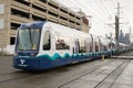 Sound Transit light rail train passing through SODO in damp weather in Seattle