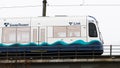 Sound Transit Link light rail train on elevated track passing by Royalty Free Stock Photo