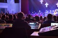 Soundman working on the mixing console. Royalty Free Stock Photo