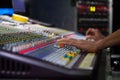 Soundman working on the mixing console. Royalty Free Stock Photo