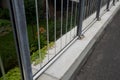 Soundproof wall of blue glass on a highway bridge embedded in metal beams, on the street. road traffic noise is reduced. safety pr