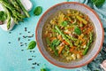 Soup with beef, asparagus, green peas, carrots and celery