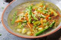 Soup with beef, asparagus, green peas, carrots and celery. Royalty Free Stock Photo