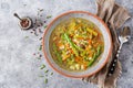 Soup with beef, asparagus, green peas, carrots and celery.