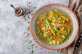 Soup with beef, asparagus, green peas, carrots and celery.