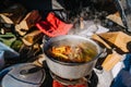 Soup Boiling on burner, cooking food outdoor on gas jet