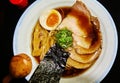 Soup bowl with Japanese shoyu ramen noodles with egg and pork in a soy broth Royalty Free Stock Photo