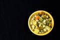 Soup bowl with pasta, beans and vegetables on black background Royalty Free Stock Photo