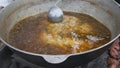 Soup or Broth in Big Vat Coocked over an Open Fire at Street Food Party