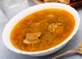 Soup of cabbage Shchi with pork and vegetables, served with sour cream Royalty Free Stock Photo