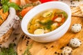 Soup with chicken meatballs and quail eggs Royalty Free Stock Photo