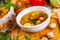 Soup with chicken meatballs, vegetable and quail eggs in white plate Royalty Free Stock Photo