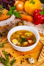 Soup with chicken meatballs, vegetable and quail eggs in white plate Royalty Free Stock Photo