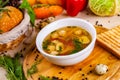 Soup with chicken meatballs, vegetable and quail eggs in white plate Royalty Free Stock Photo