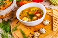 Soup with chicken meatballs, vegetable and quail eggs in white plate Royalty Free Stock Photo