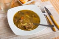 Soup with forest mushroom, pork meat and vegetables