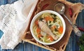 Soup with homemade noodles and organic chicken with carrots, root and leaves of parsley, onion and celery sticks. Royalty Free Stock Photo