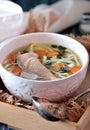 Soup with homemade noodles and organic chicken with carrots, root and leaves of parsley, onion and celery sticks. Royalty Free Stock Photo