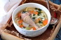 Soup with homemade noodles and organic chicken with carrots, root and leaves of parsley, onion and celery sticks. Royalty Free Stock Photo
