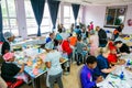 Soup Kitchen community outreach volunteers preparing desert meals for African children at orphanage Royalty Free Stock Photo