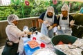 Soup Kitchen community outreach volunteers preparing meals for African children at orphanage Royalty Free Stock Photo