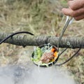 Soup ladle with meat and vegetables