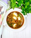 Soup lentil with spinach and cheese on board top Royalty Free Stock Photo