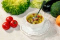 Soup with meat balls, potatoes and vegetables in a white plate on a white table Royalty Free Stock Photo